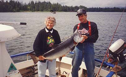 Fishing charter guide, Skip Fabry, and happy guest with king salmon catch-of-the-day.